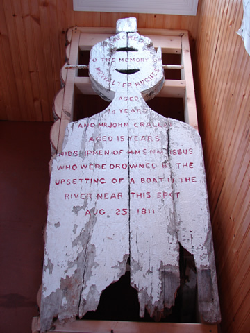 Wooden grave marker, now in the Croque Interpretation Center, commemorating midshipmen Hughes and Crallan (d. 1811).